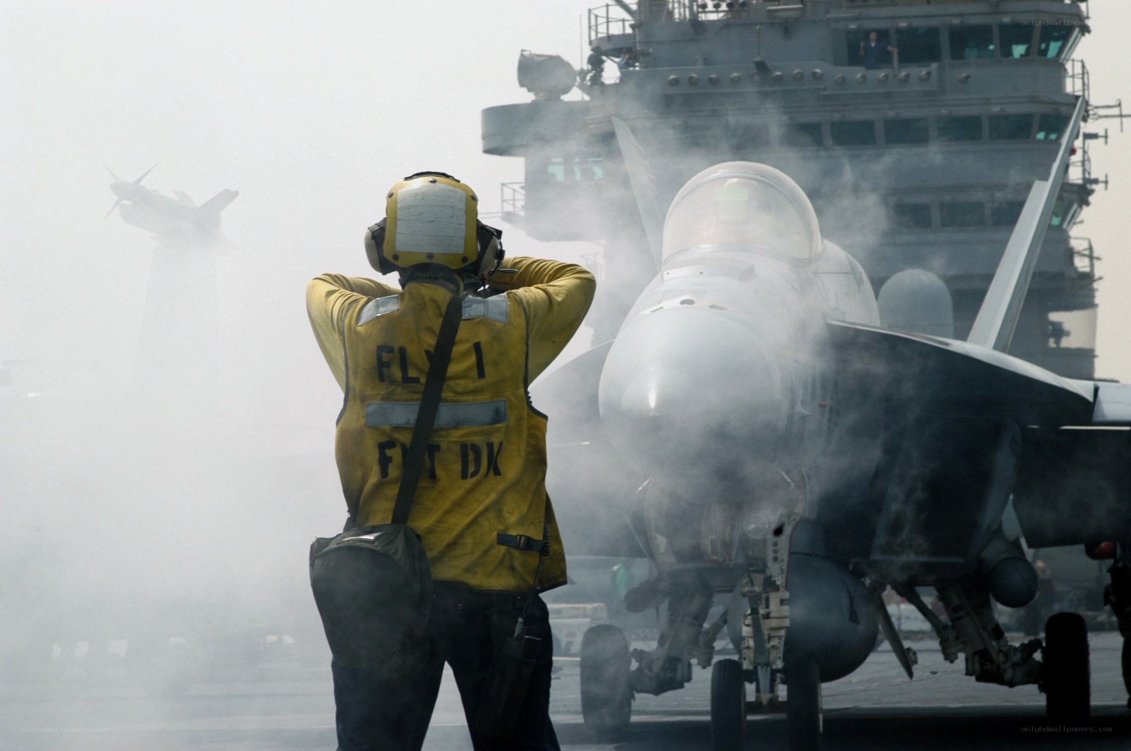 Jet on aircraft carrier deck