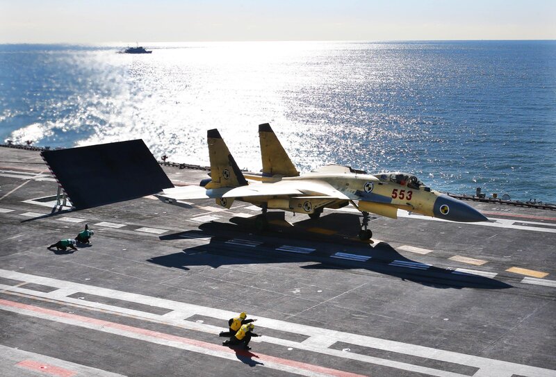 Jet on aircraft carrier deck