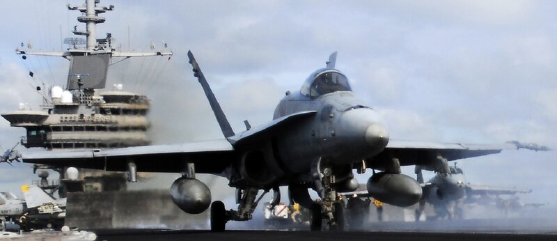 Jet on aircraft carrier deck