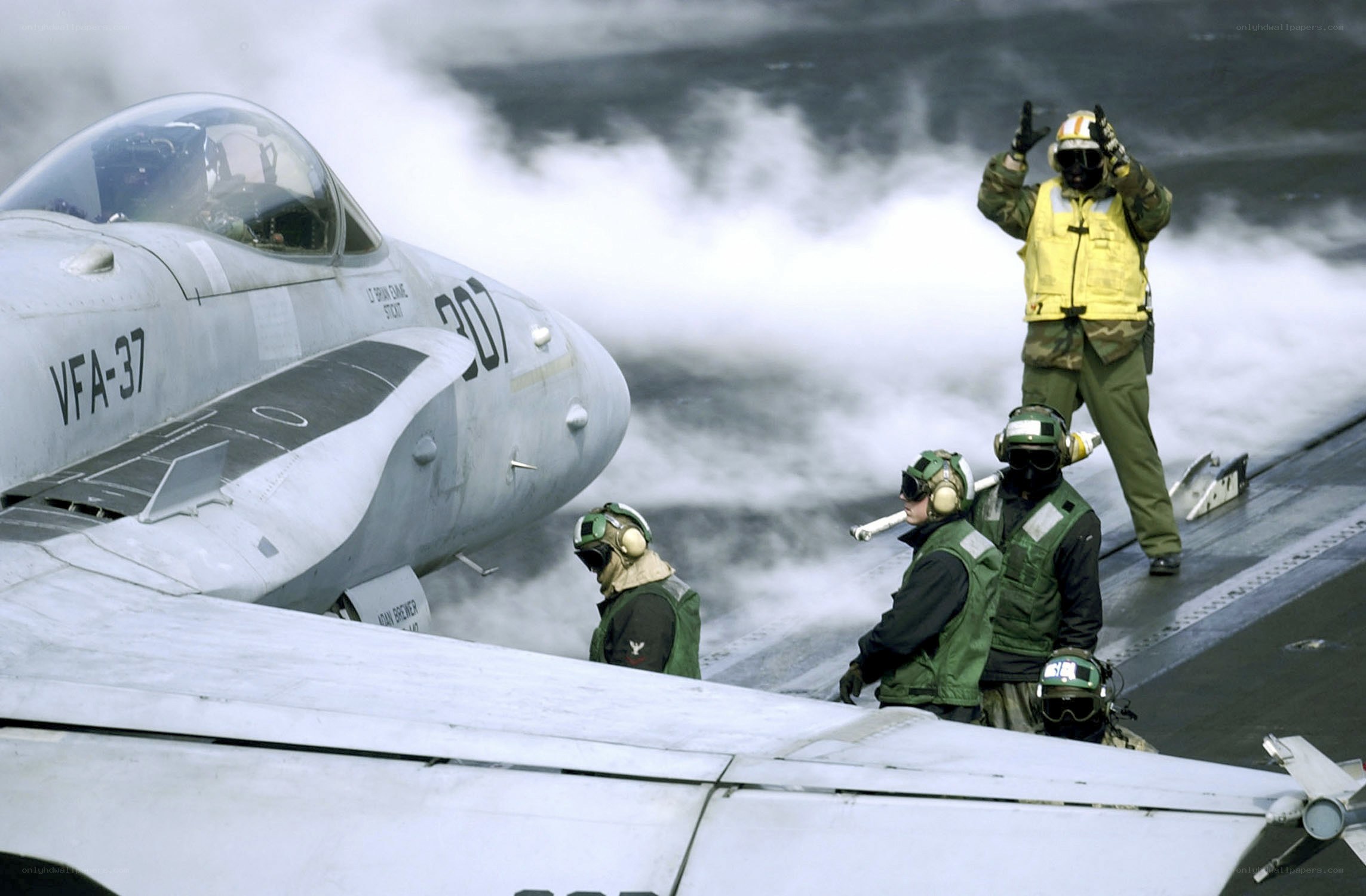 Jet on aircraft carrier deck