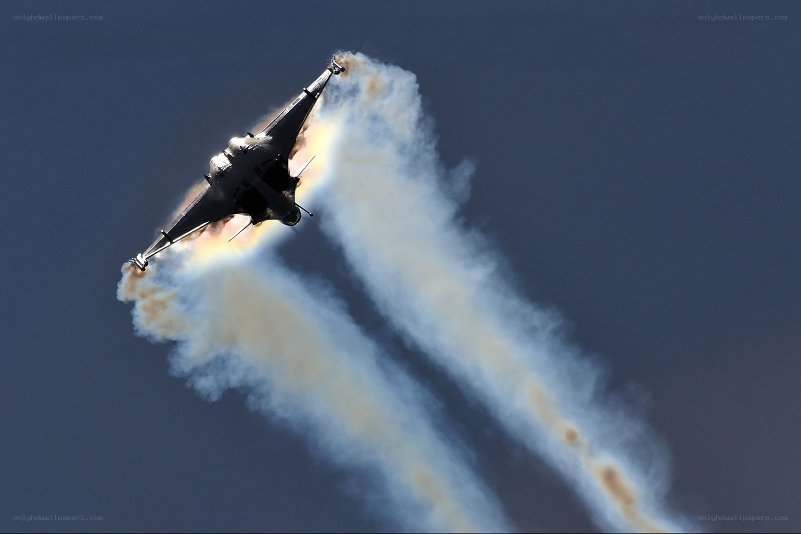 Jet performing aerobatic maneuver