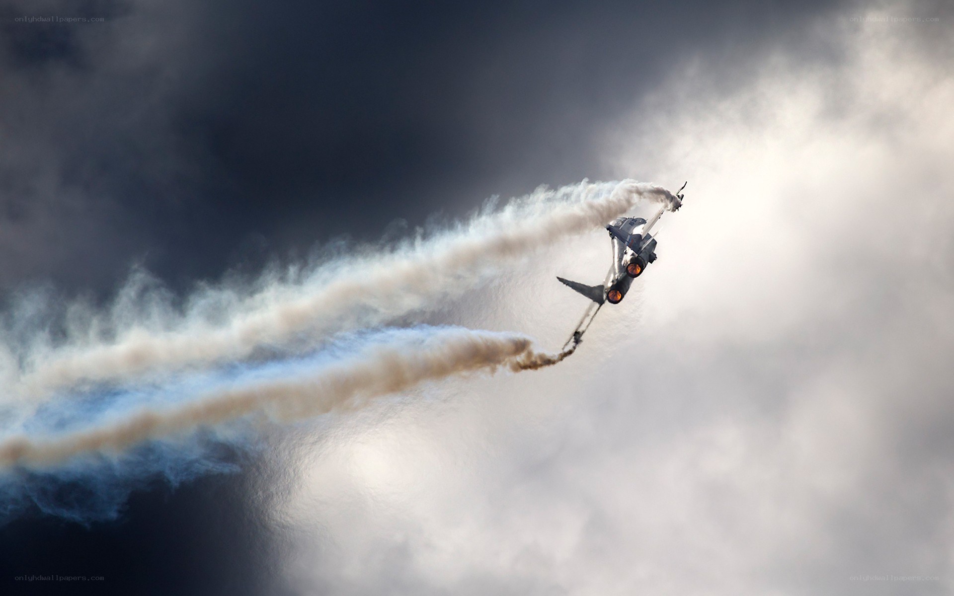 Jet performing aerobatic maneuver