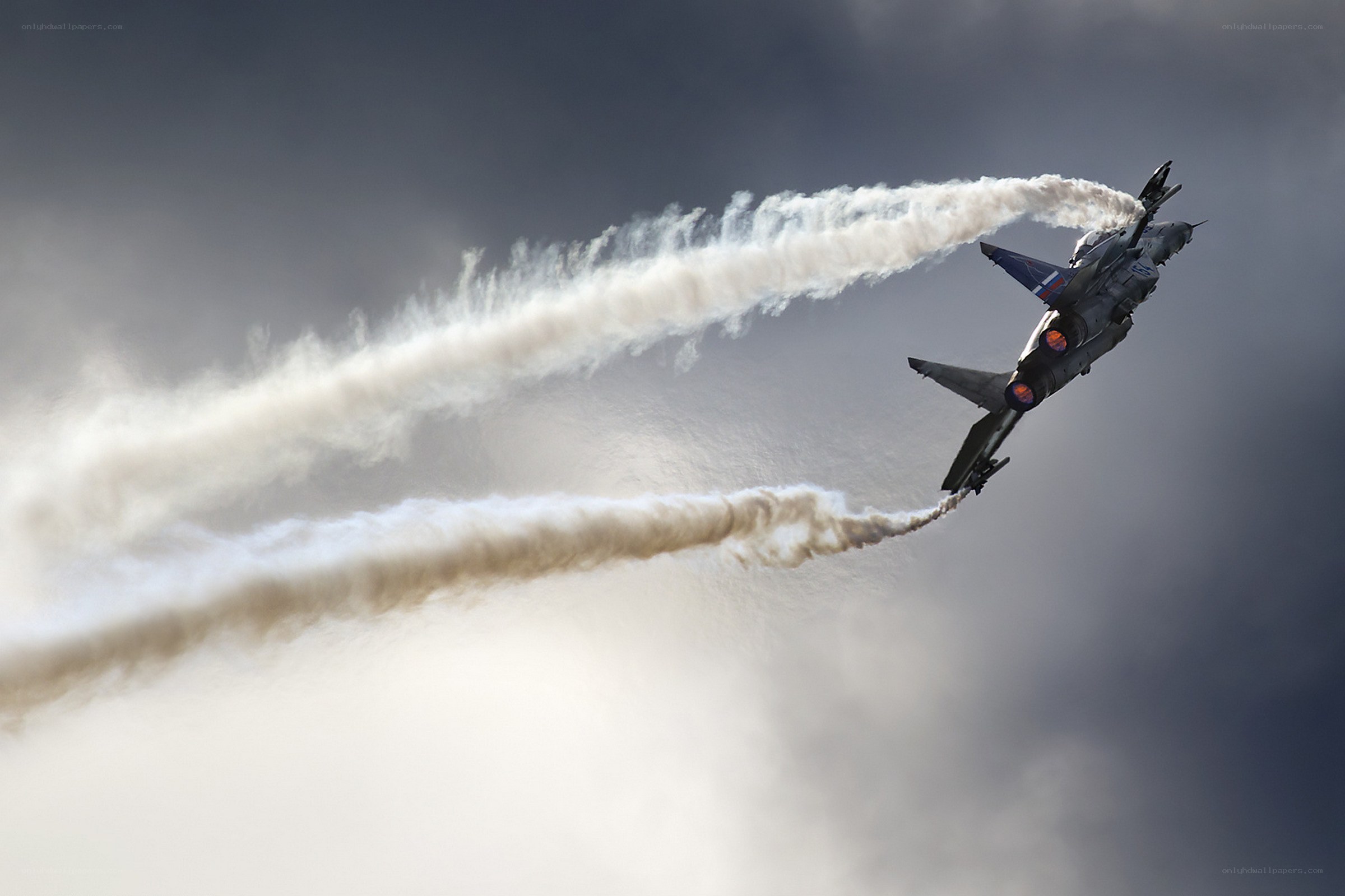 Jet performing aerobatic maneuver