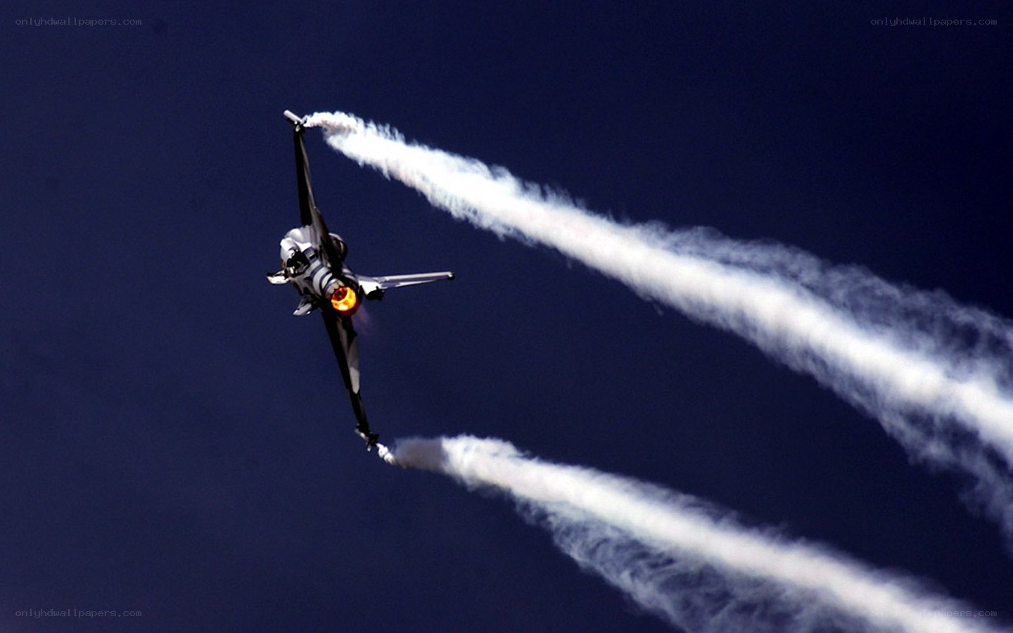 Jet performing aerobatic maneuver