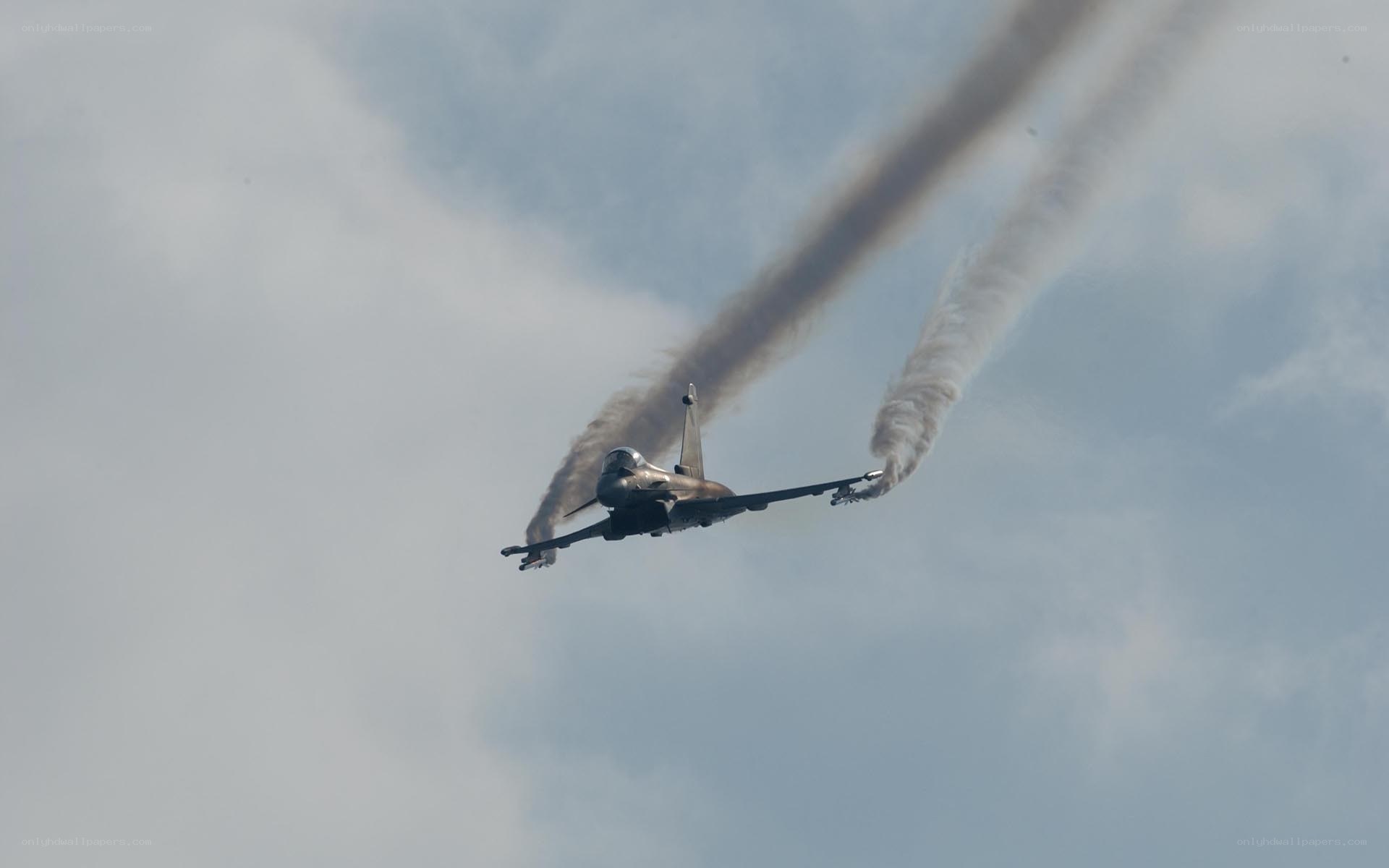 Jet performing aerobatic maneuver