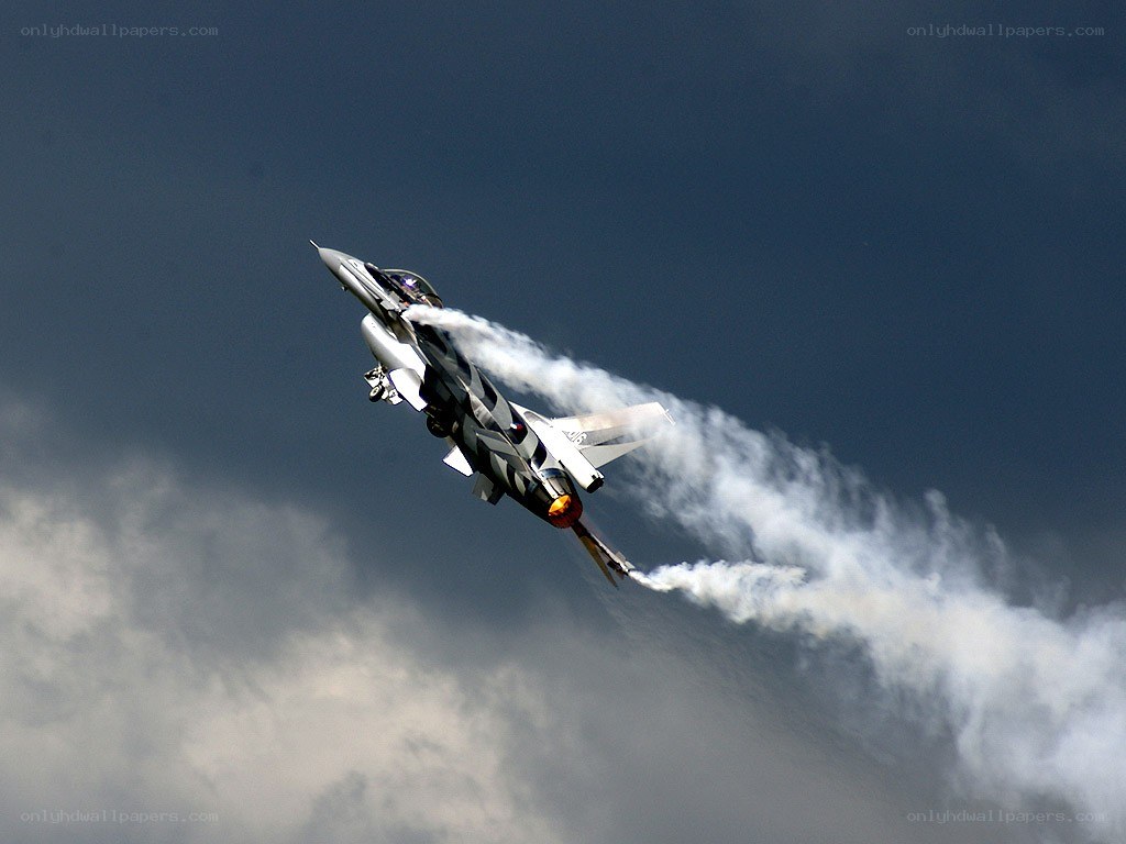 Jet performing aerobatic maneuver