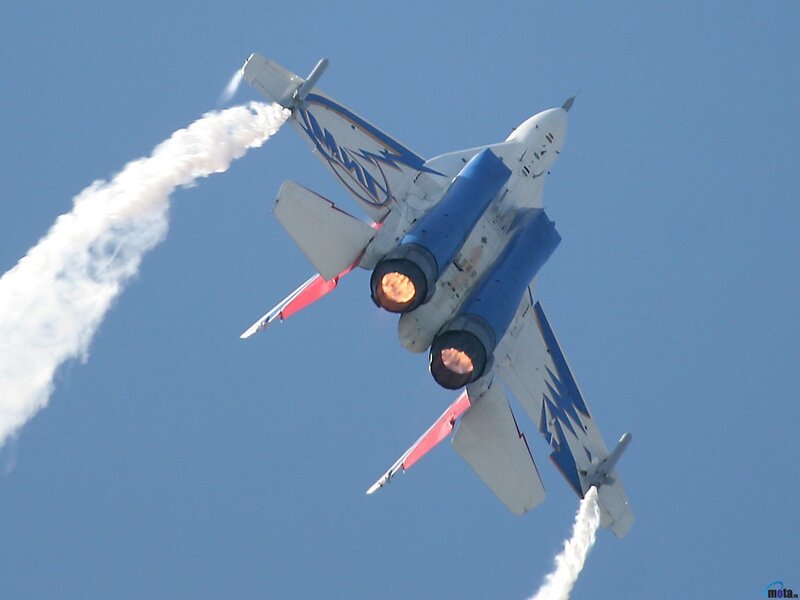 jet performing aerobatic maneuver
