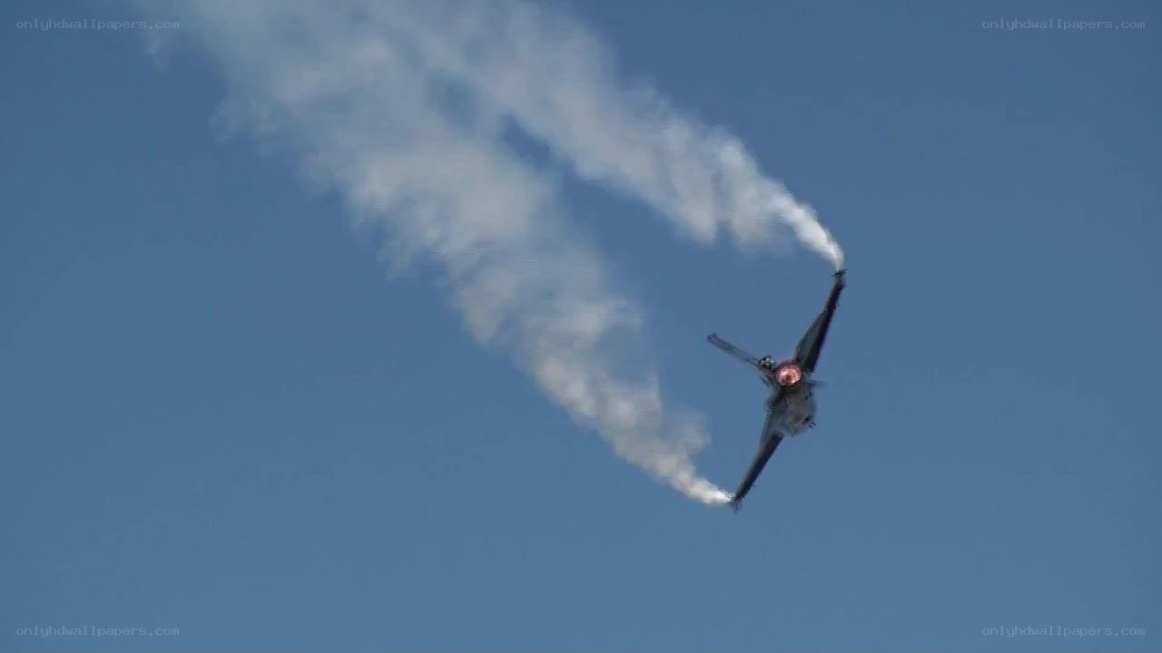Jet performing aerobatic maneuver
