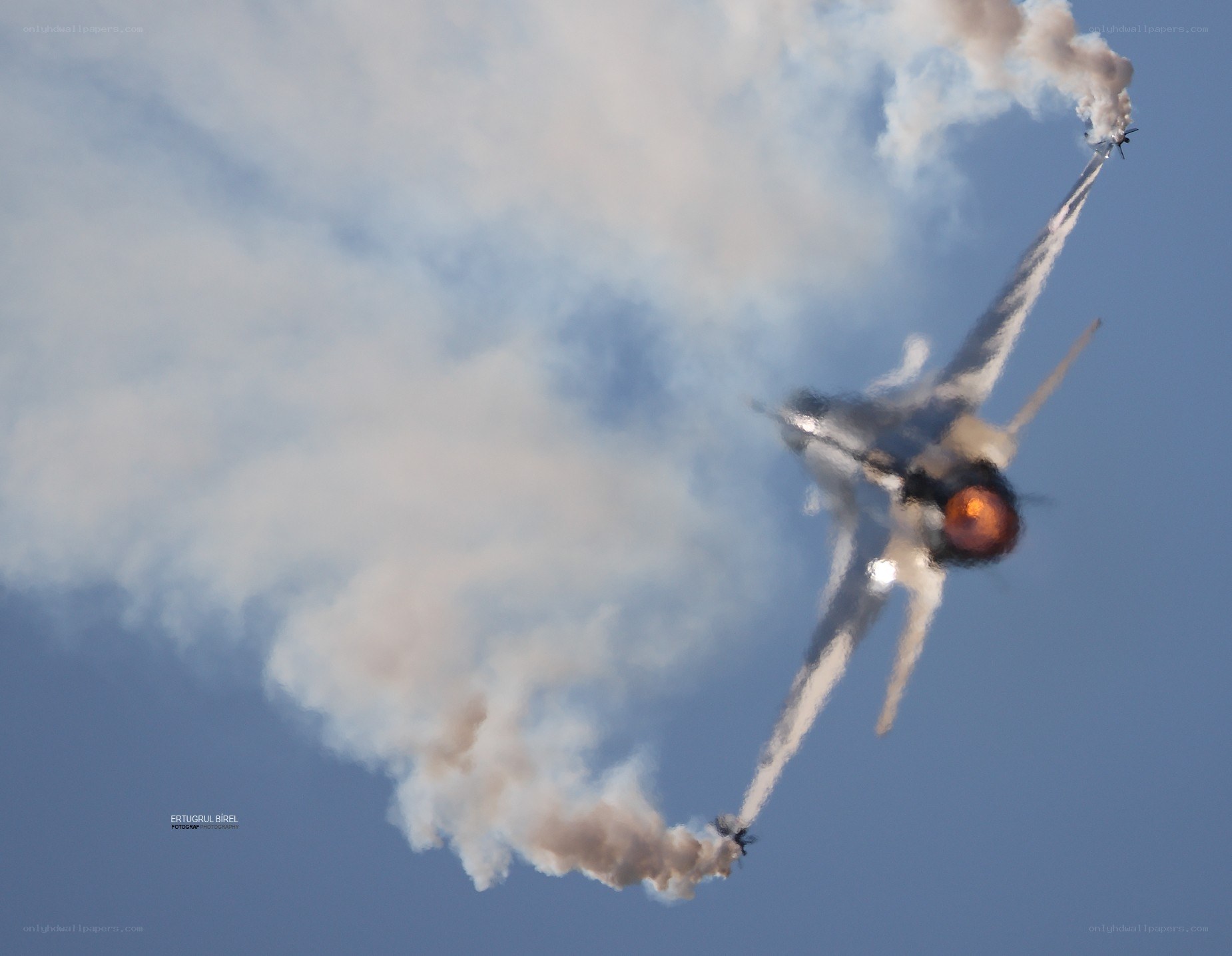 Jet performing aerobatic maneuver