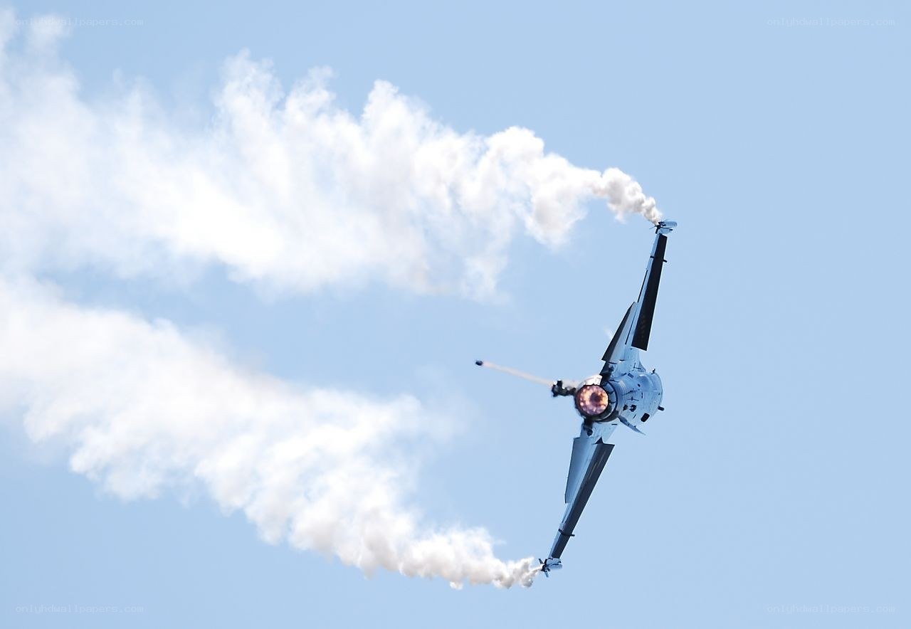 Jet performing aerobatic maneuver
