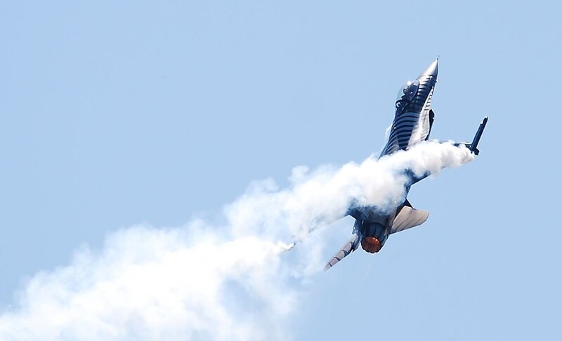 Jet performing aerobatic maneuver