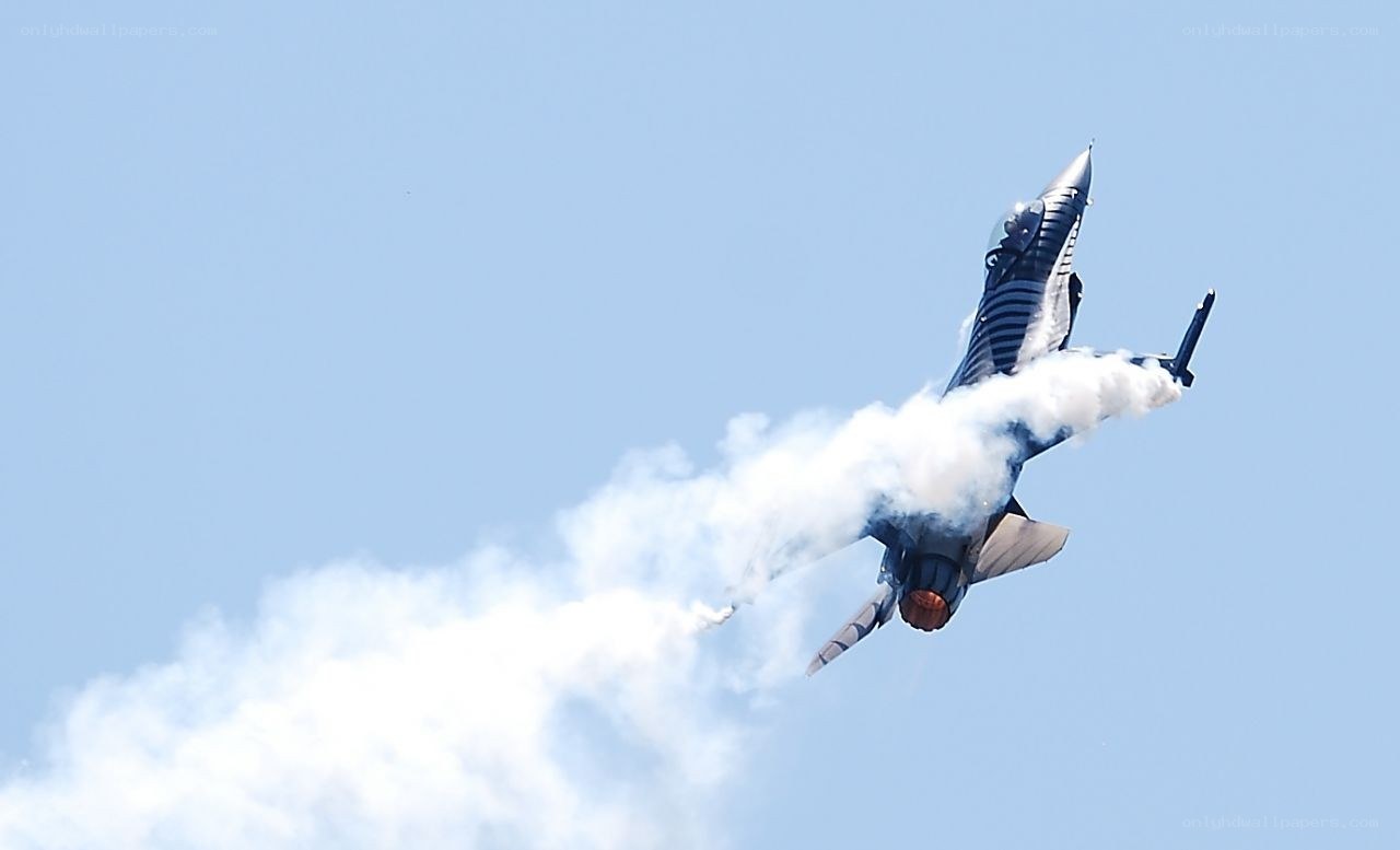 Jet performing aerobatic maneuver