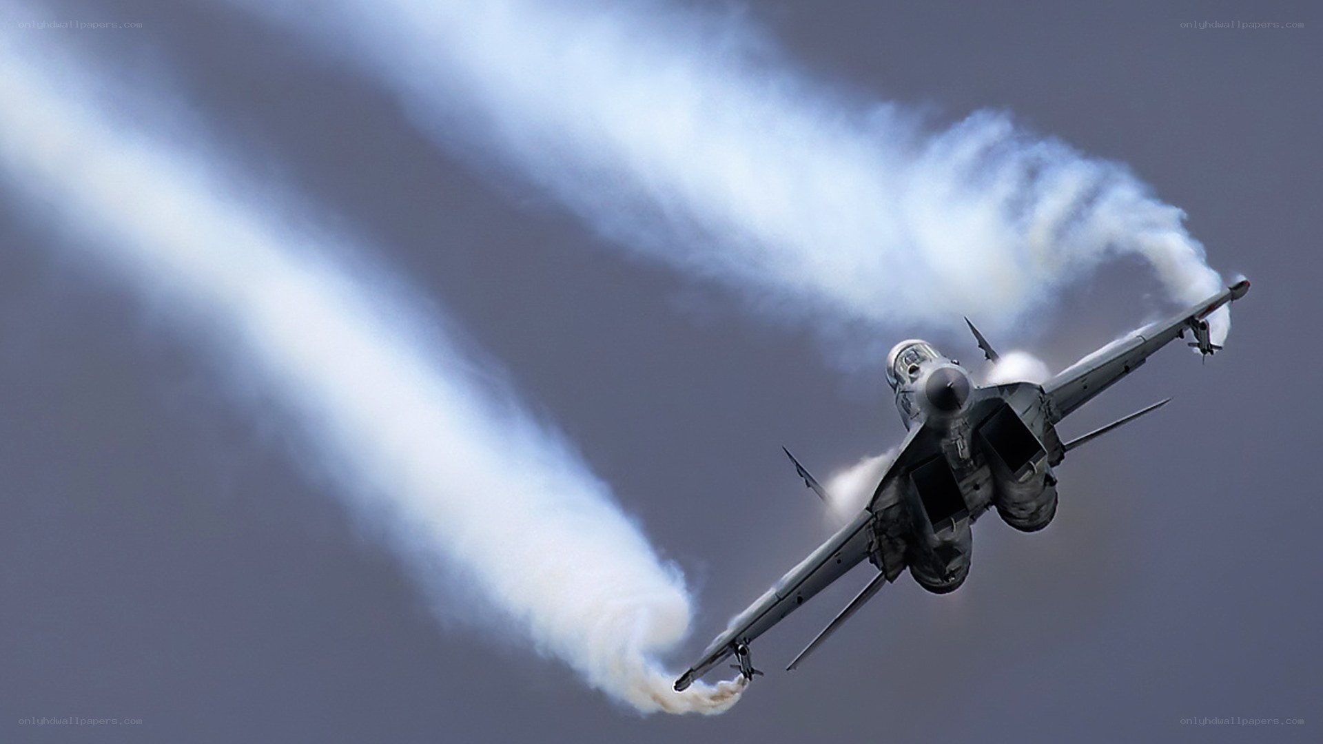 Jet performing aerobatic maneuver