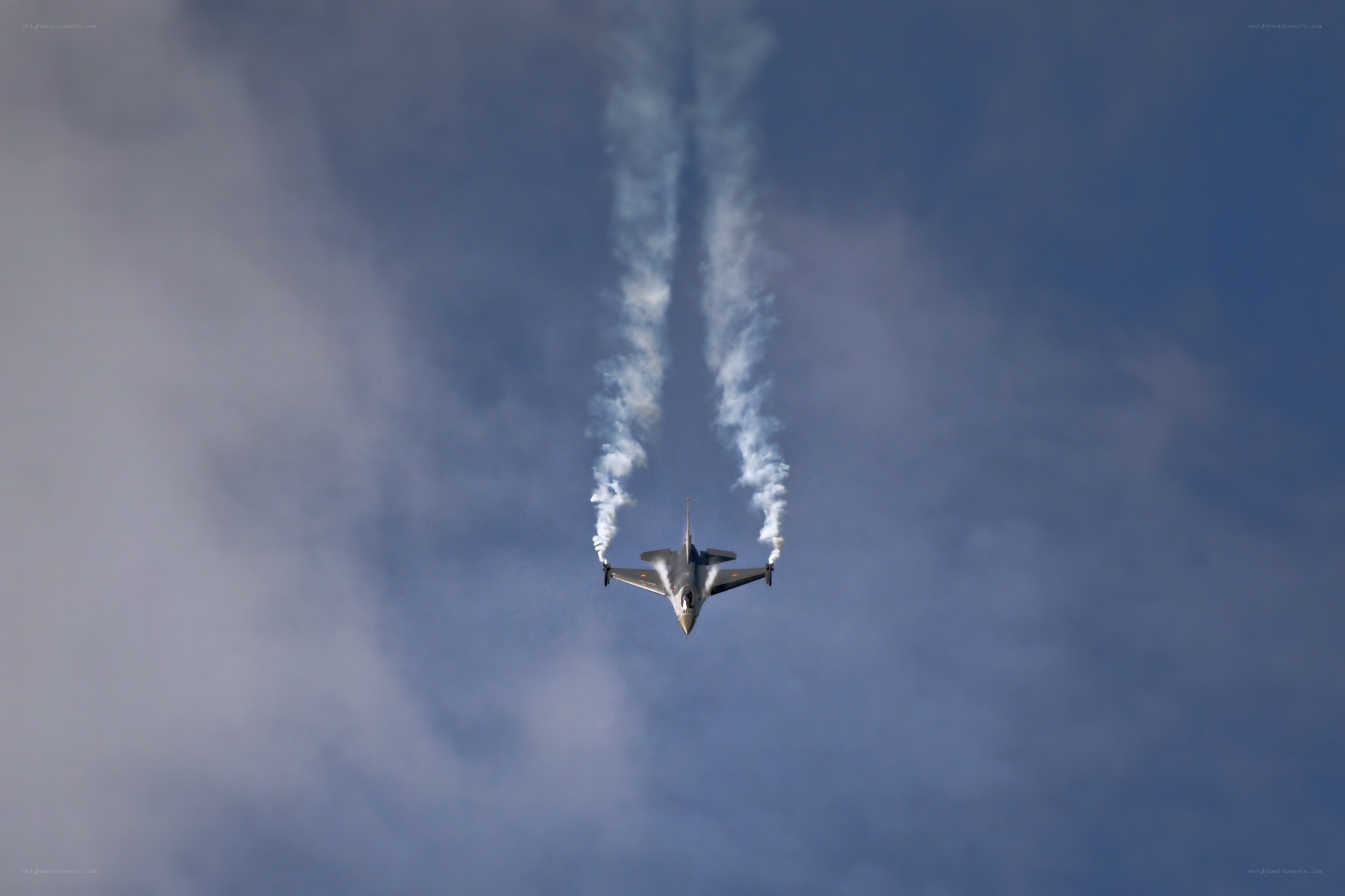 Jet performing aerobatic maneuver