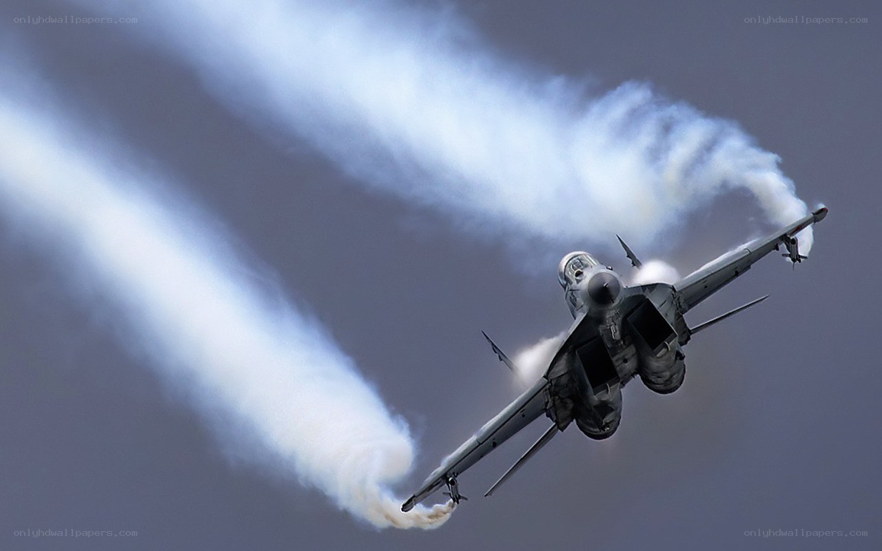 Jet performing aerobatic maneuver