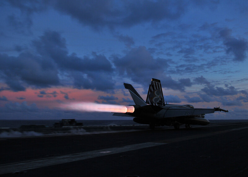 Jet taking off at dusk
