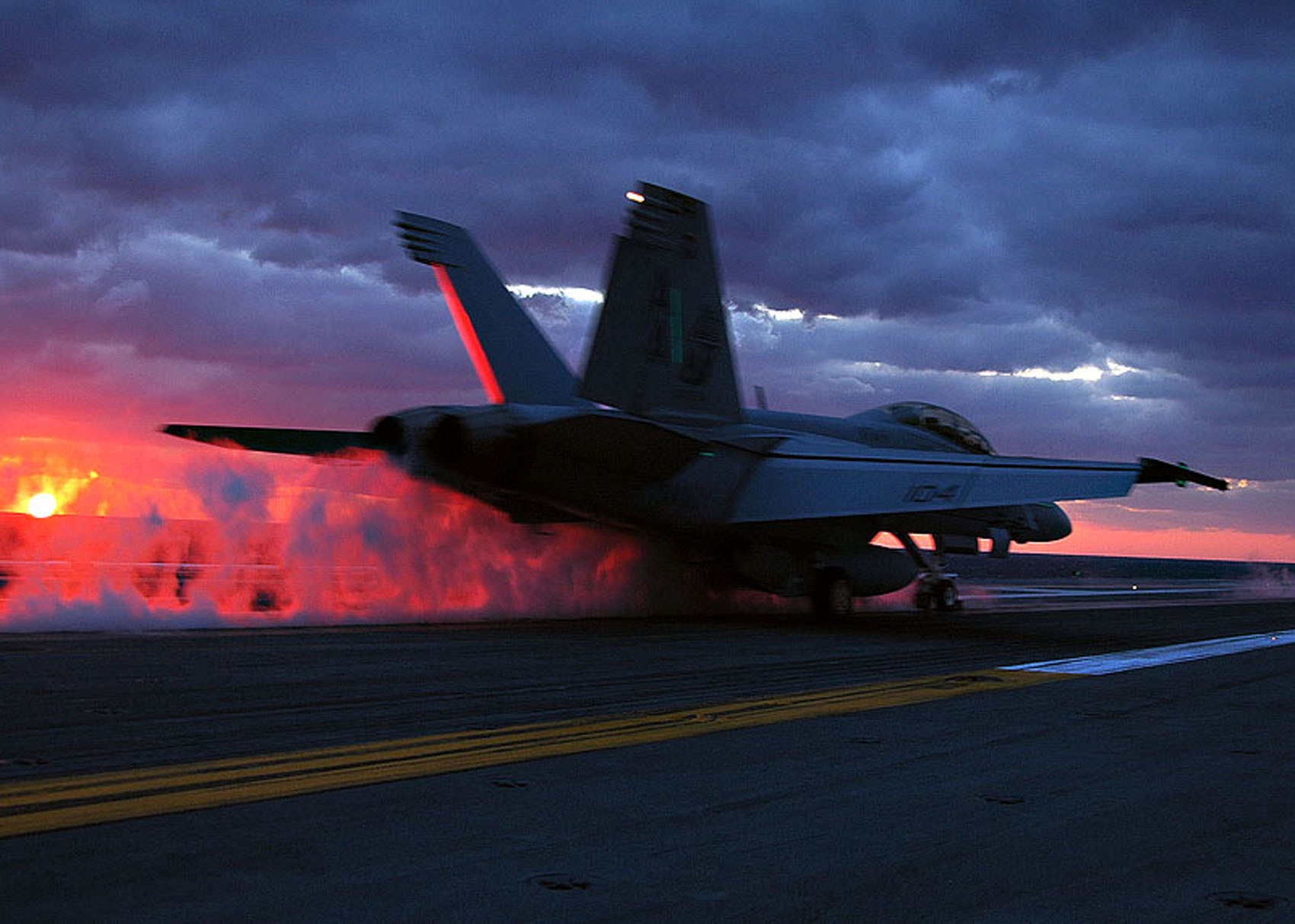 Jet taking off at sunset