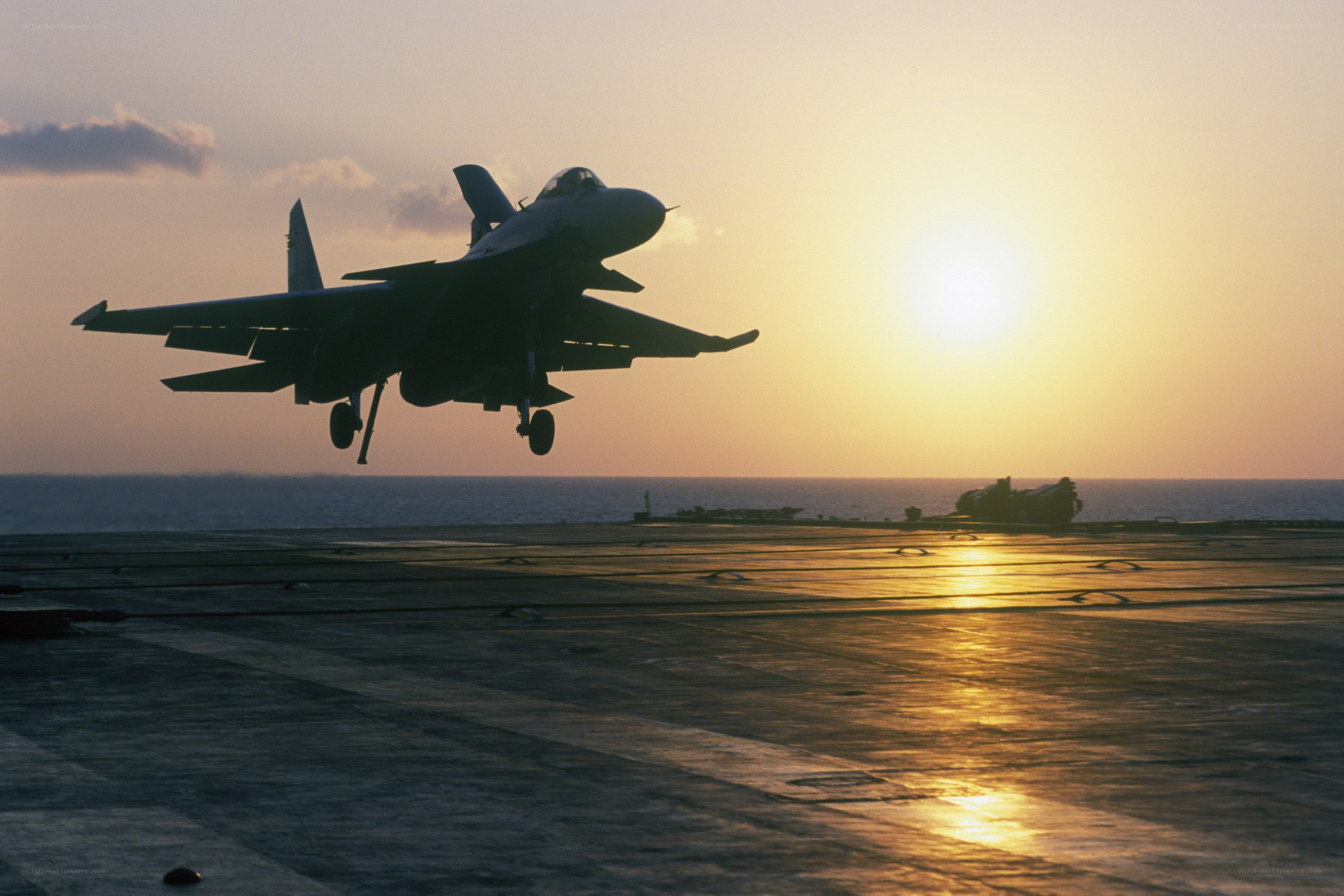 Jet taking off at sunset