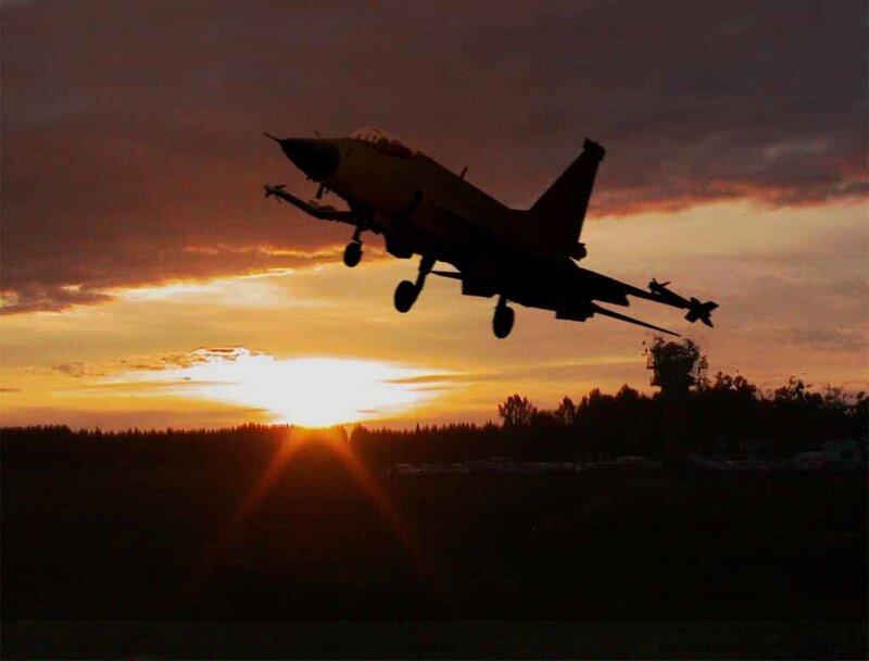 Jet taking off at sunset