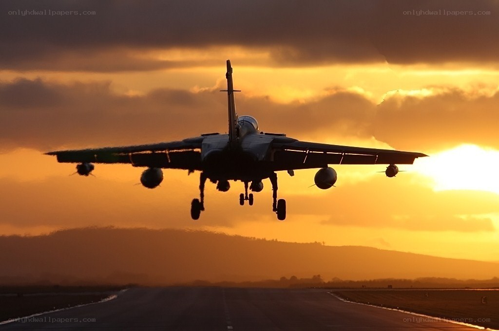 Jet taking off at sunset