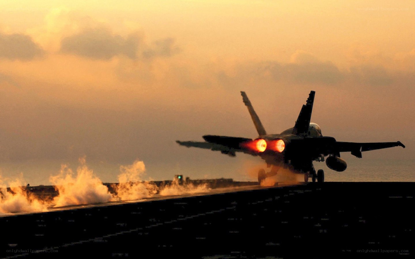 Jet taking off at sunset