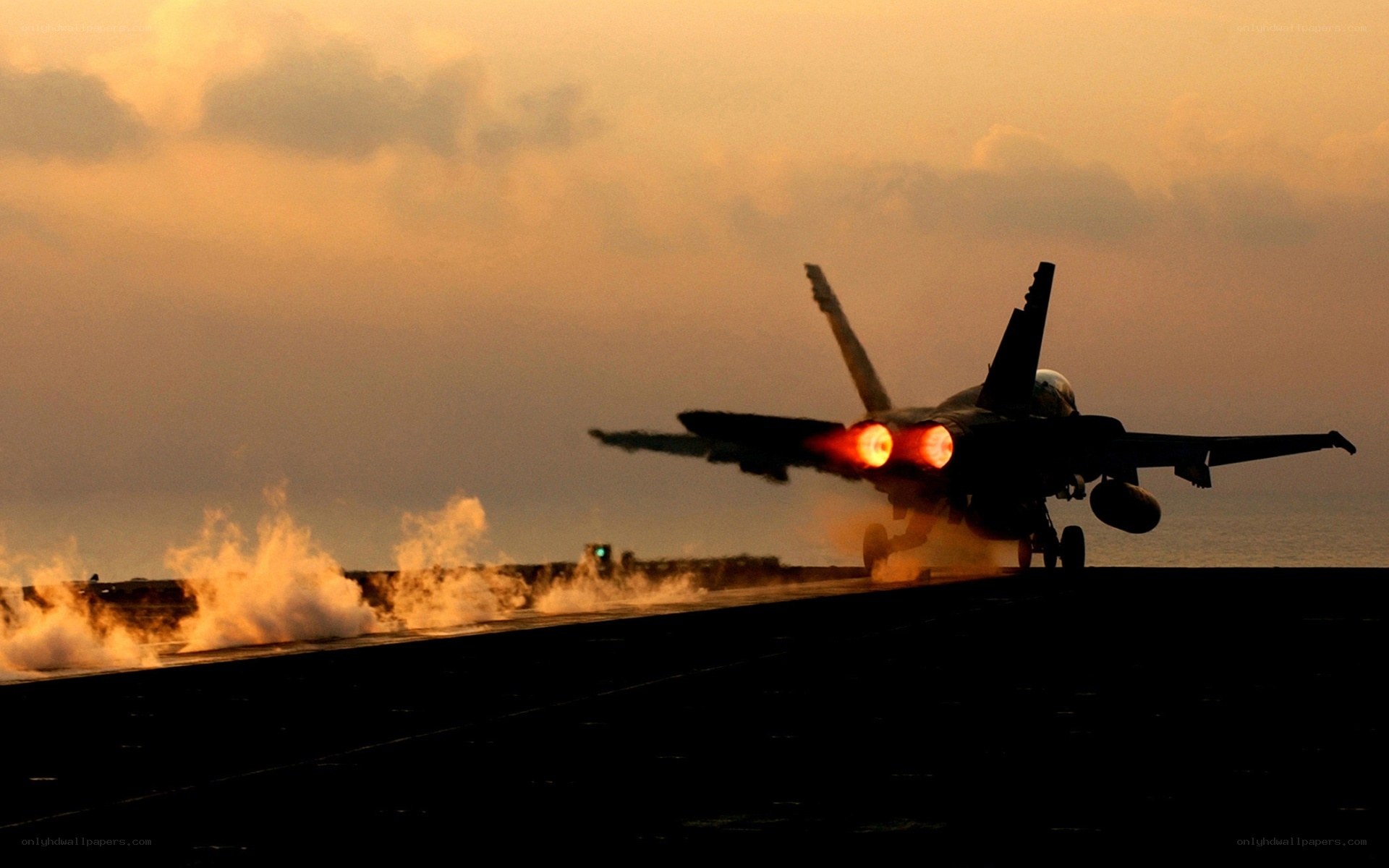 Jet taking off at sunset