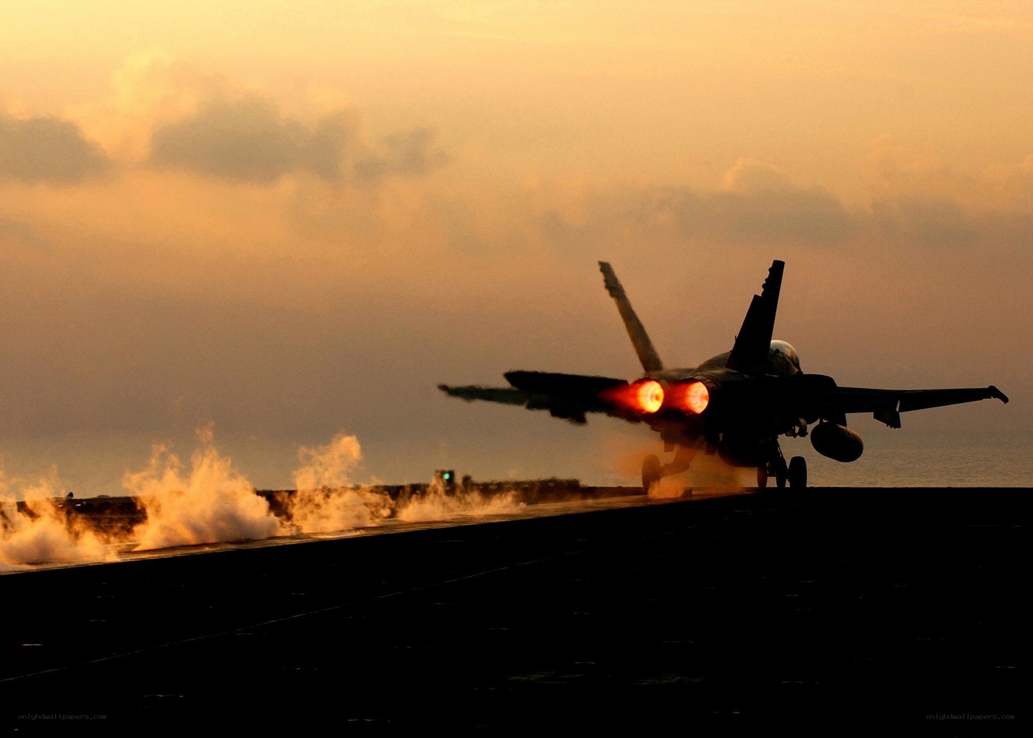 Jet taking off at sunset