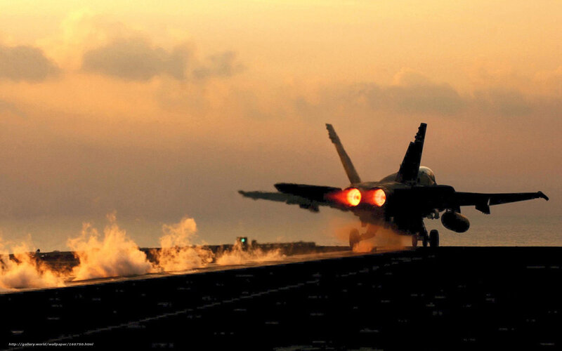 Jet taking off at sunset