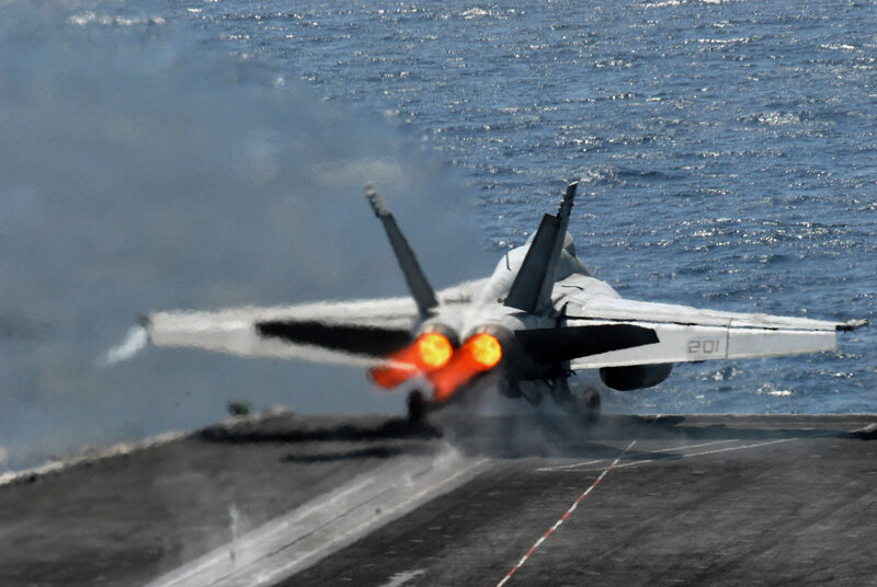 Jet taking off from aircraft carrier