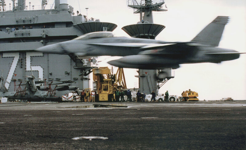 Jet taking off from aircraft carrier