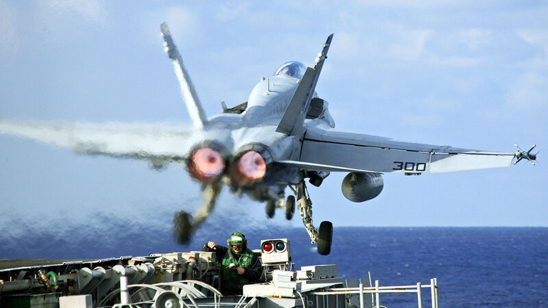 Jet taking off from aircraft carrier