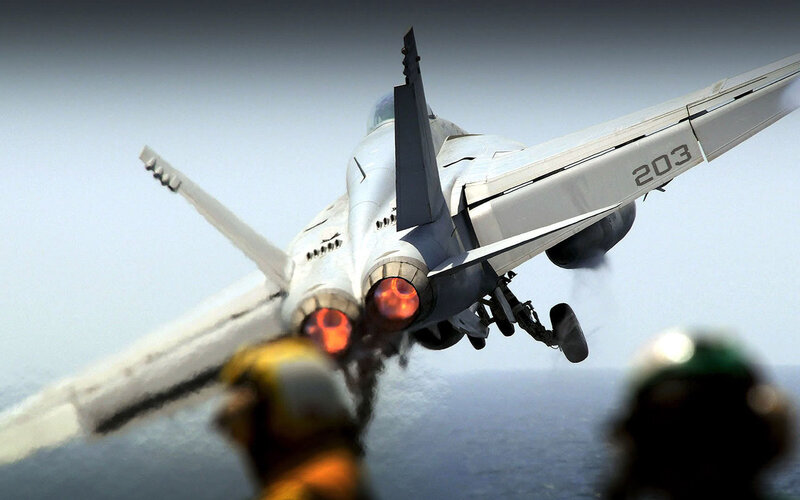 Jet taking off from aircraft carrier