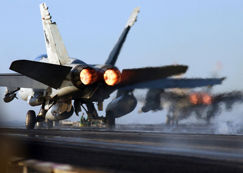 Jet taking off from aircraft carrier