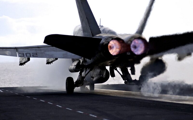 Jet taking off from aircraft carrier