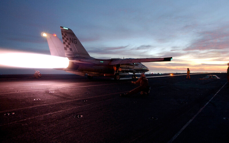 Jet taking off from aircraft carrier