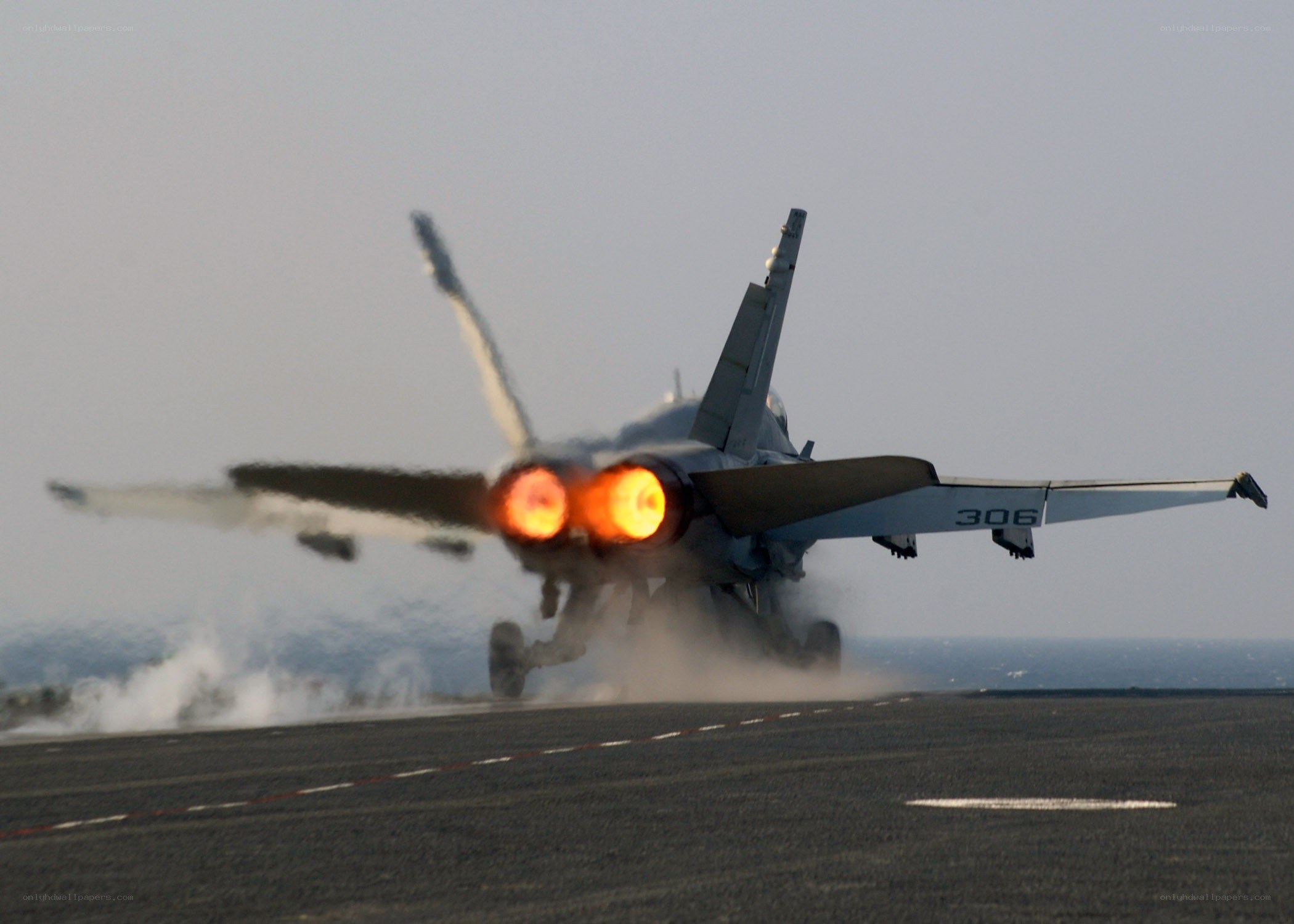 Jet taking off from aircraft carrier