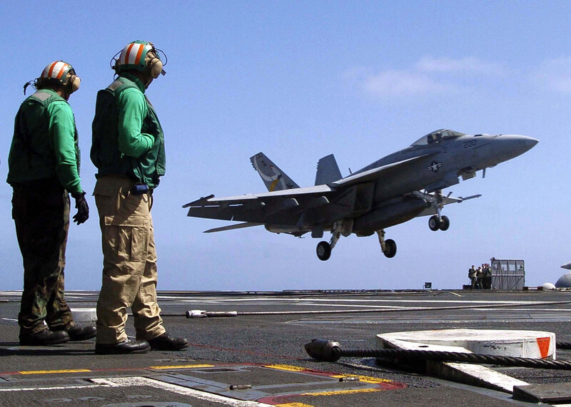 Jet taking off from aircraft carrier