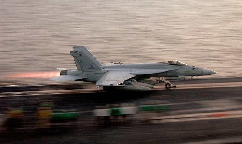 Jet taking off from aircraft carrier