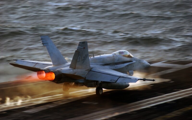 Jet taking off from aircraft carrier