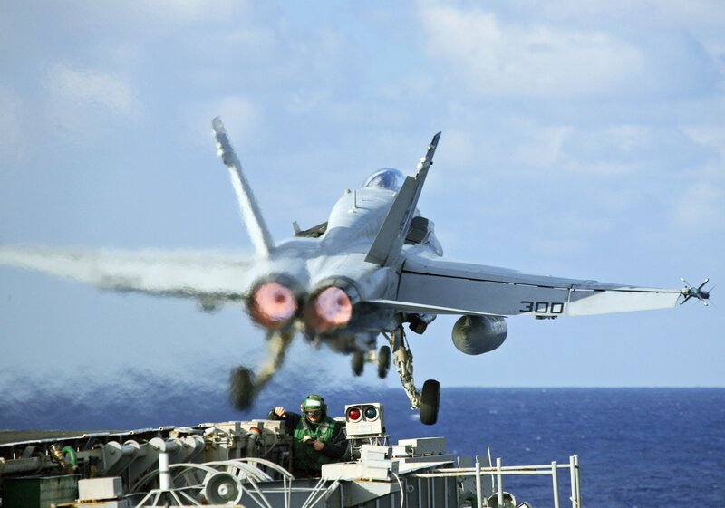Jet taking off from aircraft carrier