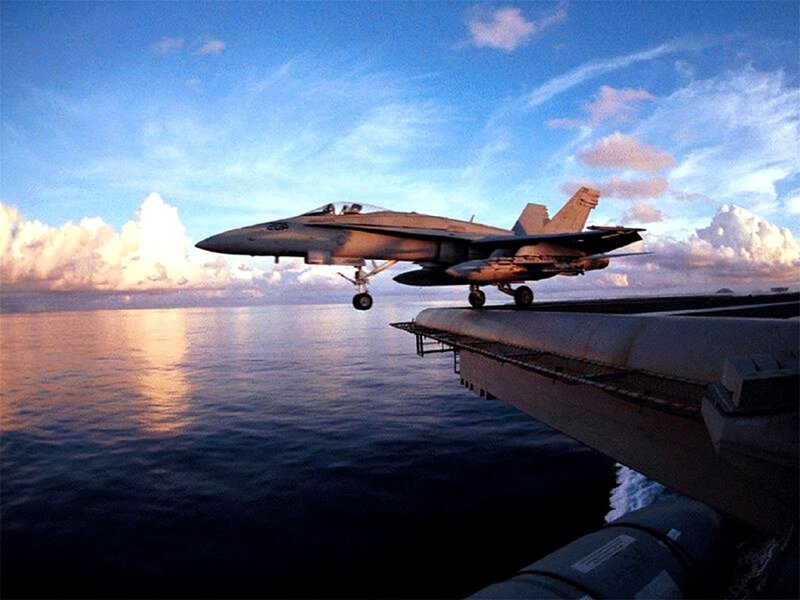 Jet taking off from aircraft carrier