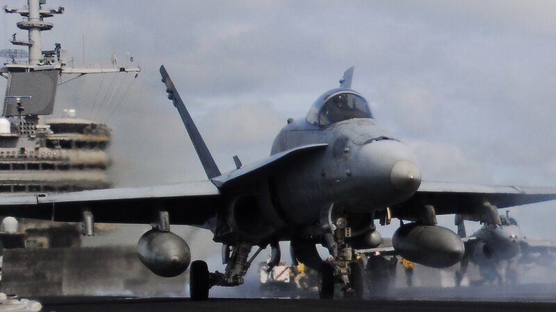 Jet taking off from aircraft carrier