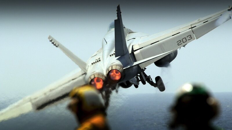 Jet taking off from aircraft carrier