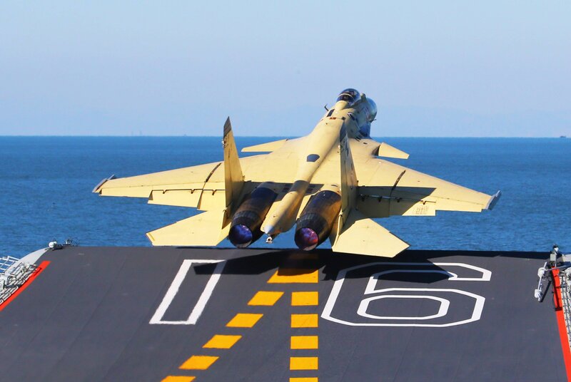 Jet taking off from aircraft carrier