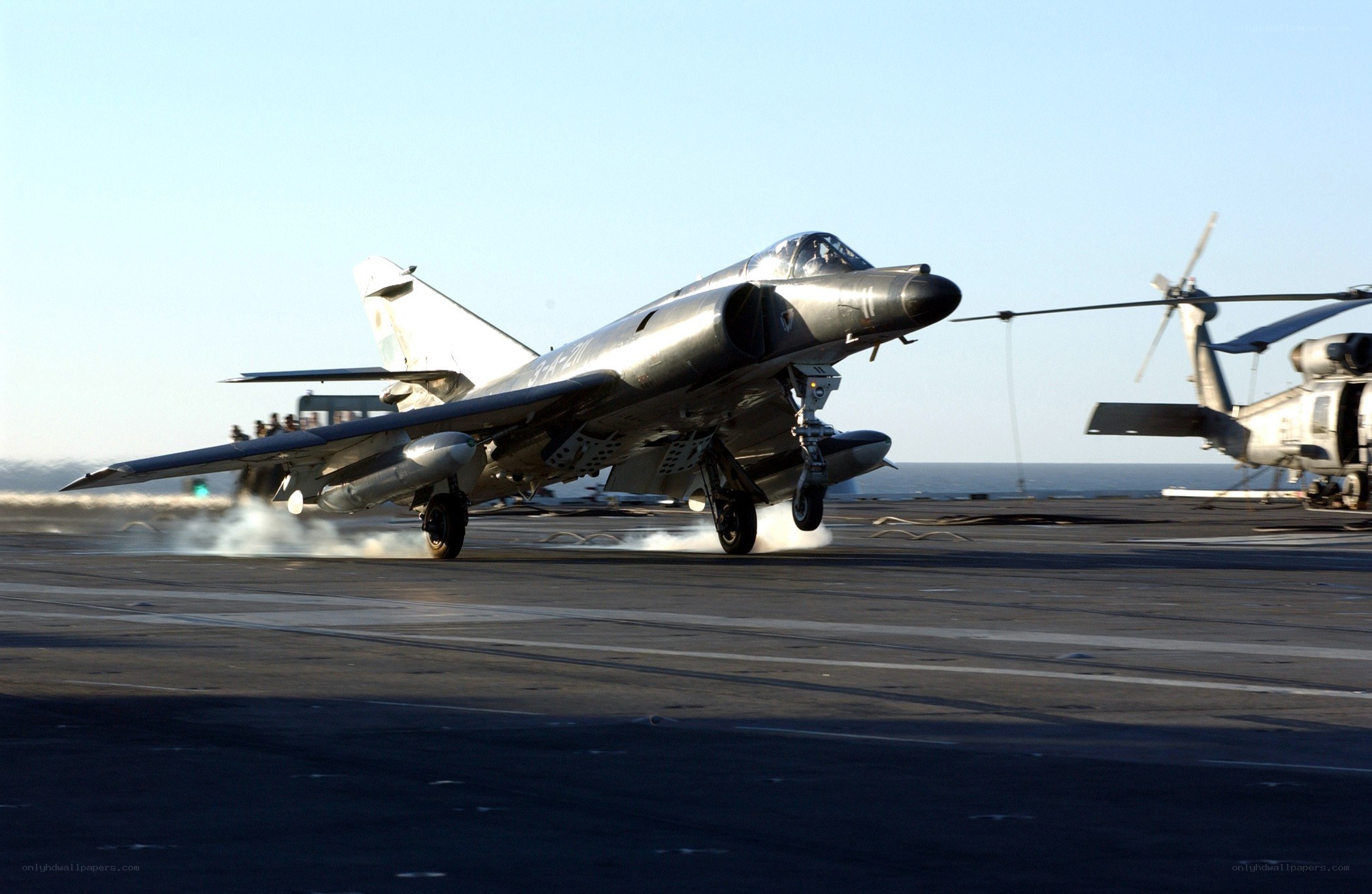 Jet taking off from aircraft carrier