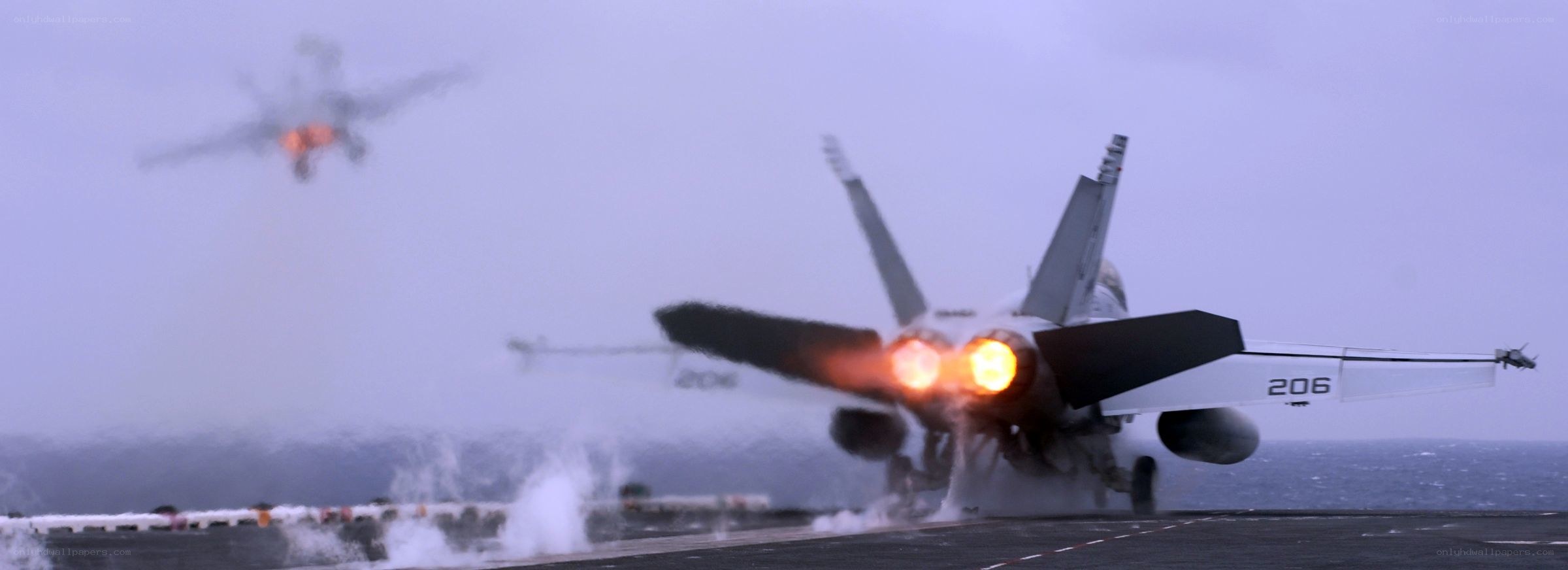Jet taking off from aircraft carrier