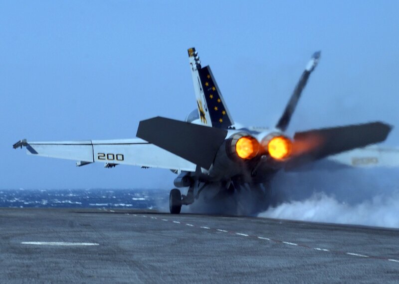 Jet taking off from aircraft carrier