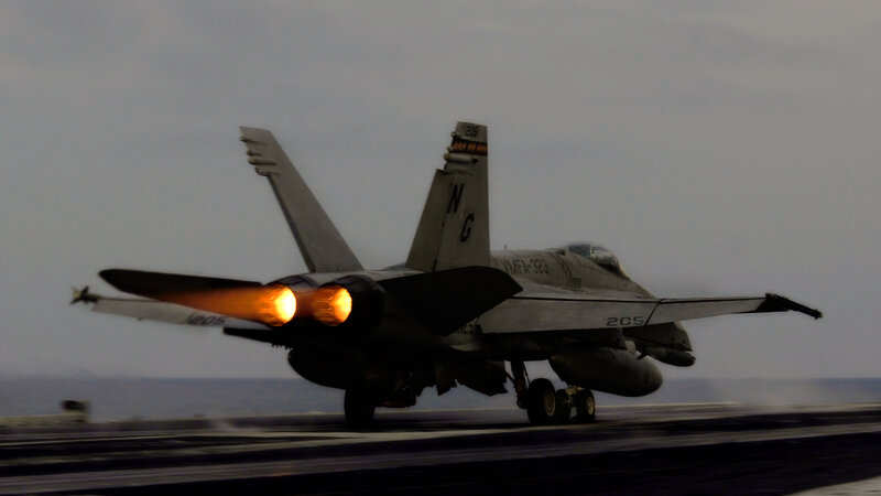 Jet taking off from aircraft carrier