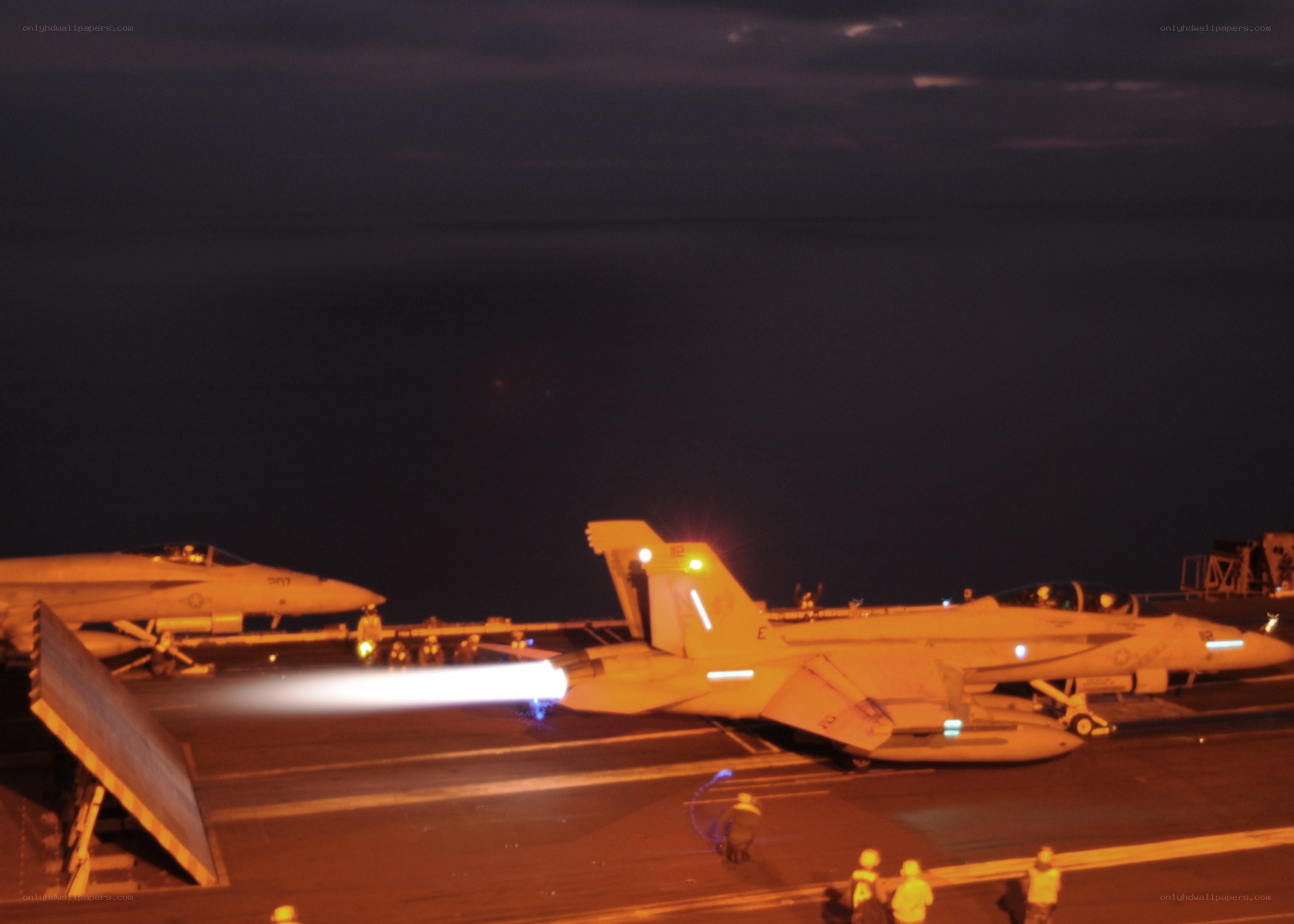 Jet taking off from aircraft carrier