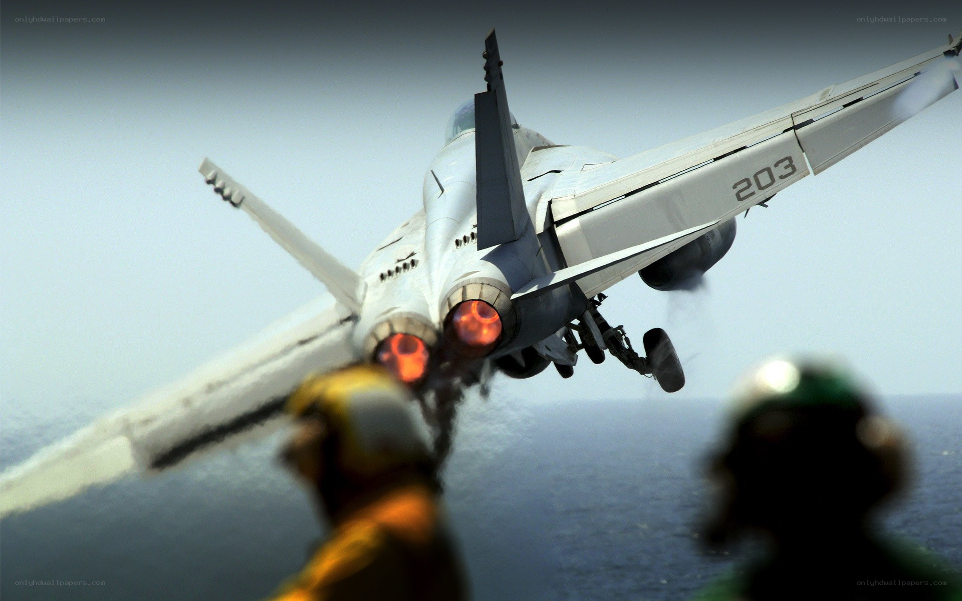 Jet taking off from aircraft carrier